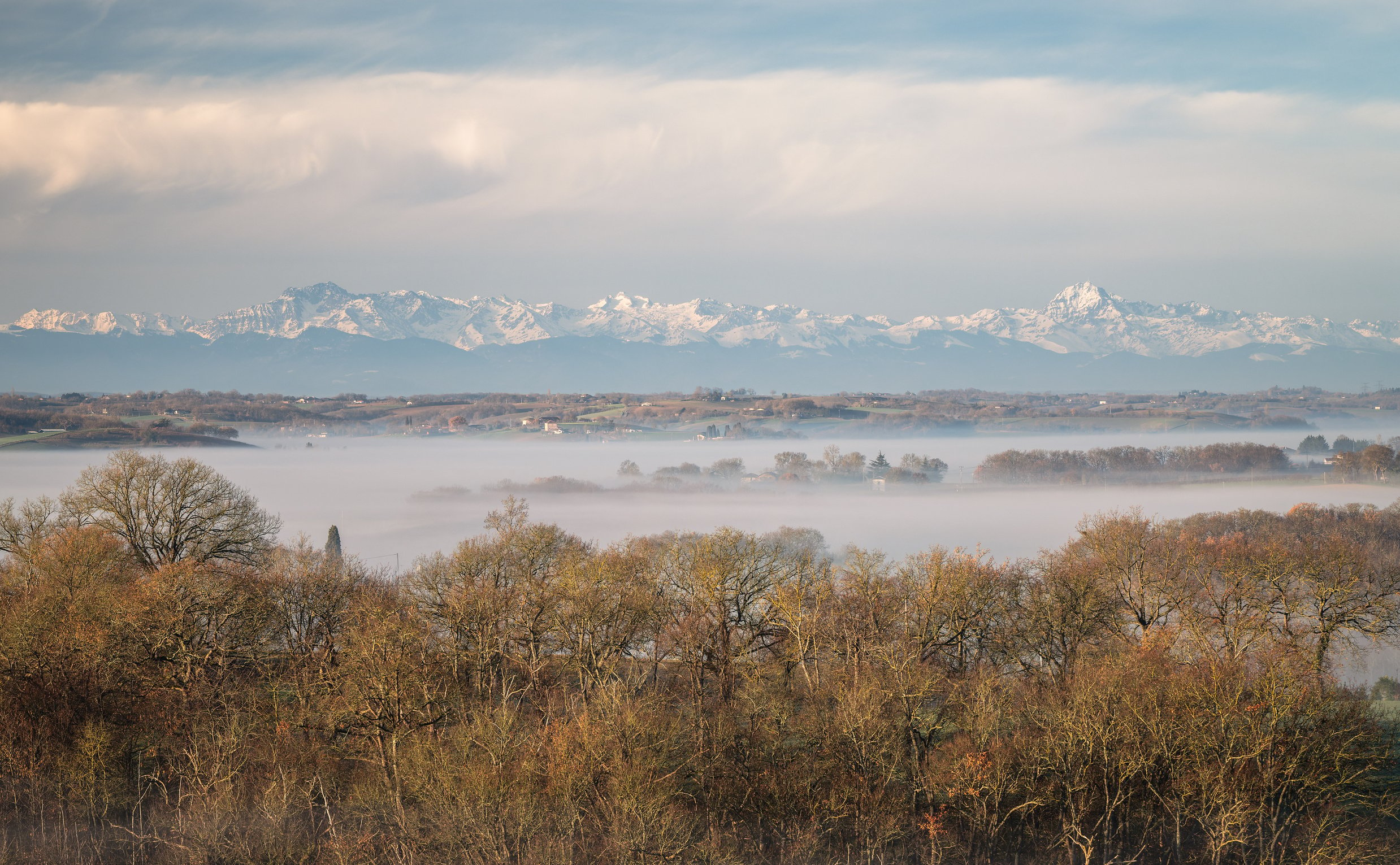 Gers department in France with the Pyrenees mountains in the background